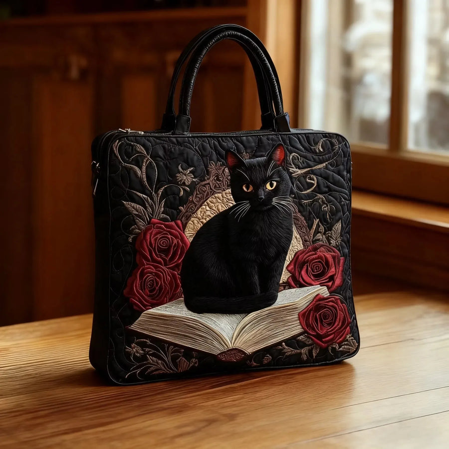 Gesteppte Künstlertasche – Schwarze Katze auf Büchern